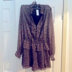 Upscale, long sleeved romper by Barney’s New York, size L.